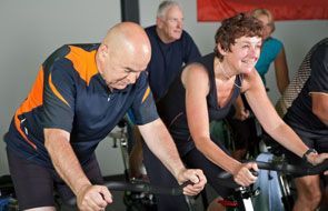 old couple doing bike exercise