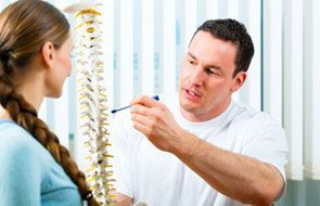 physician explaining to patient about spinal cord