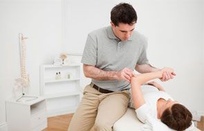 physician examining patient's arm