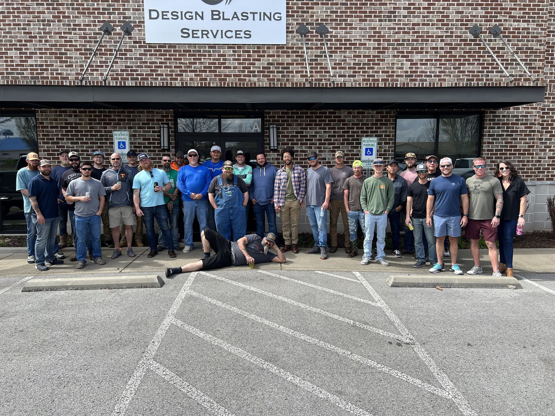Group of people outside a brick building with