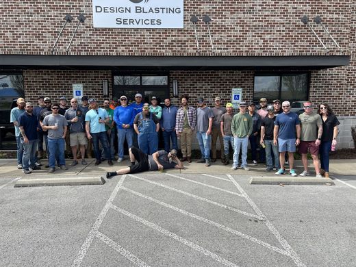 Group of people outside a brick building with 