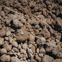 A pile of rocks sitting on top of each other on the ground.