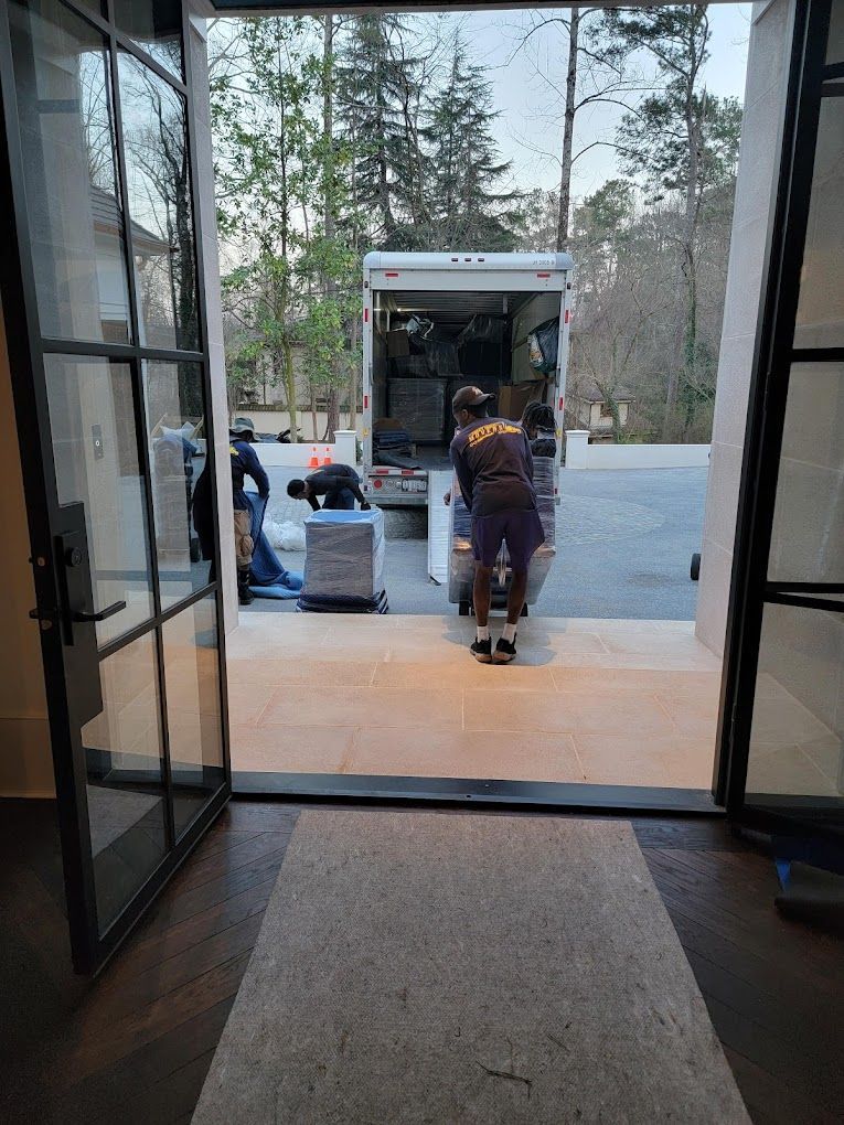 A man is pushing a box into a truck.