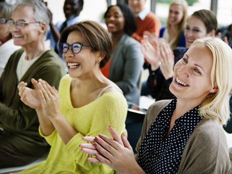 People clapping on the awardee