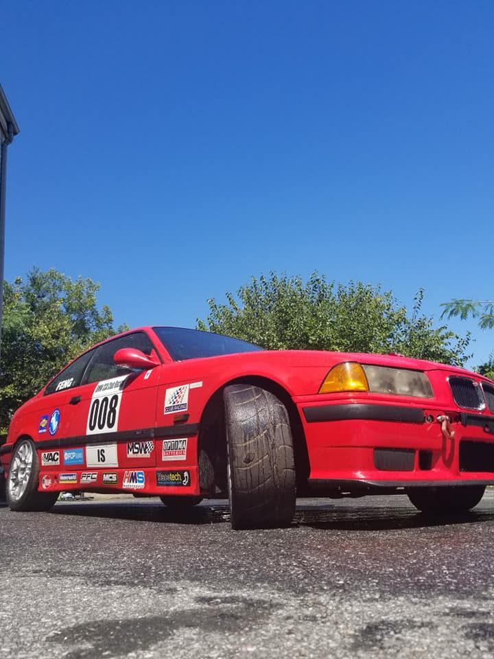 A red race car with the number 908 on the side