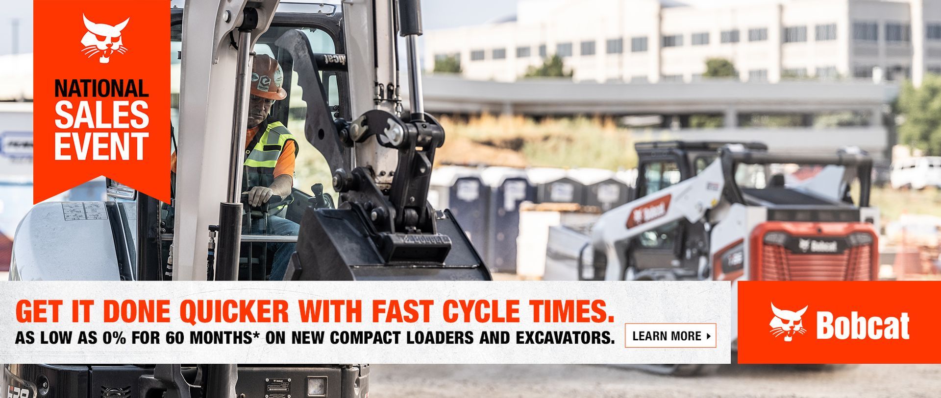 A man is driving a bobcat tractor on a construction site.