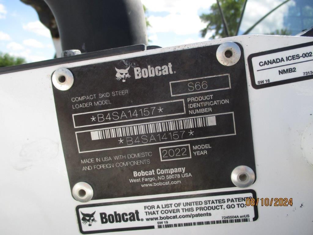 A bobcat label that is on a white surface
