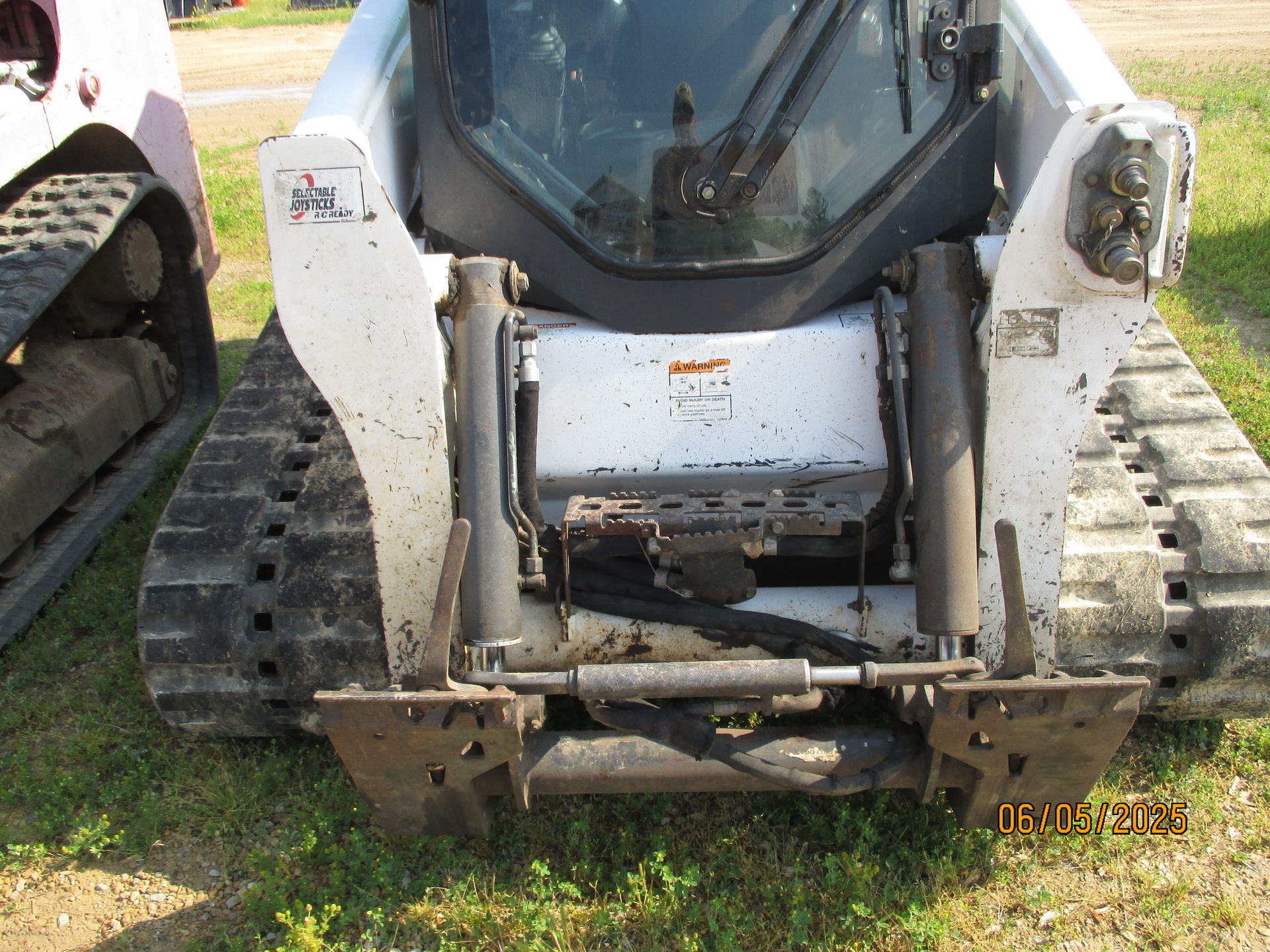 The front of a bobcat tractor