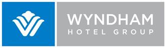 The wyndham hotel group logo is blue and white on a gray background.