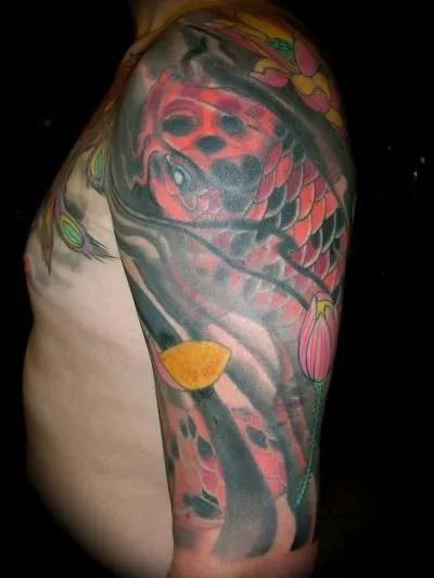 Arm tattoo of a red koi fish, lotus flowers, and water flowing.