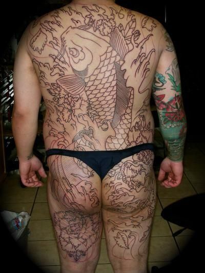 Person with a large koi fish tattoo on their back and legs; line art is visible.