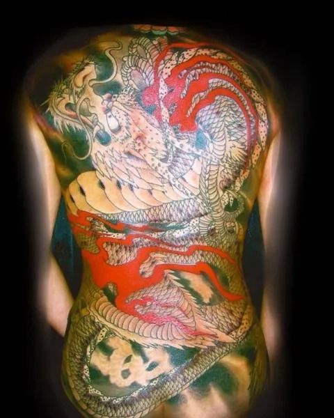 Full back tattoo: white and red dragon design.
