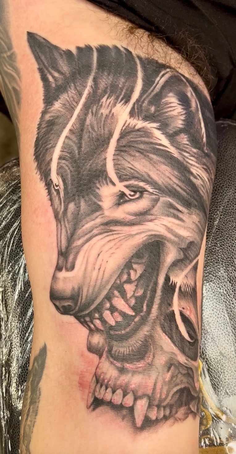 A menacing wolf tattoo