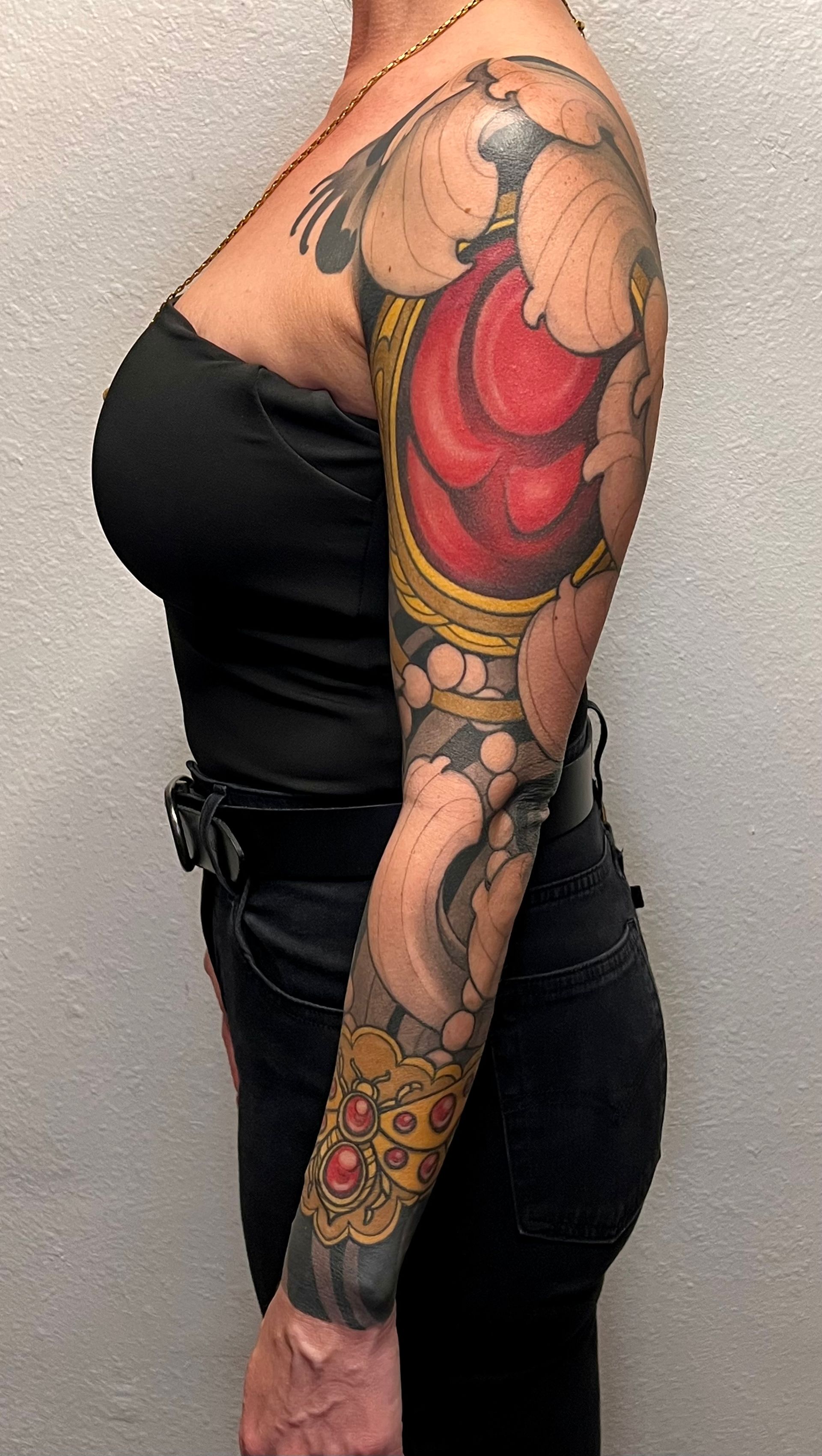 Side profile view of a full sleave tattoo