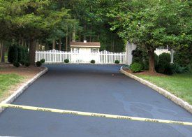 Driveway sealcoating