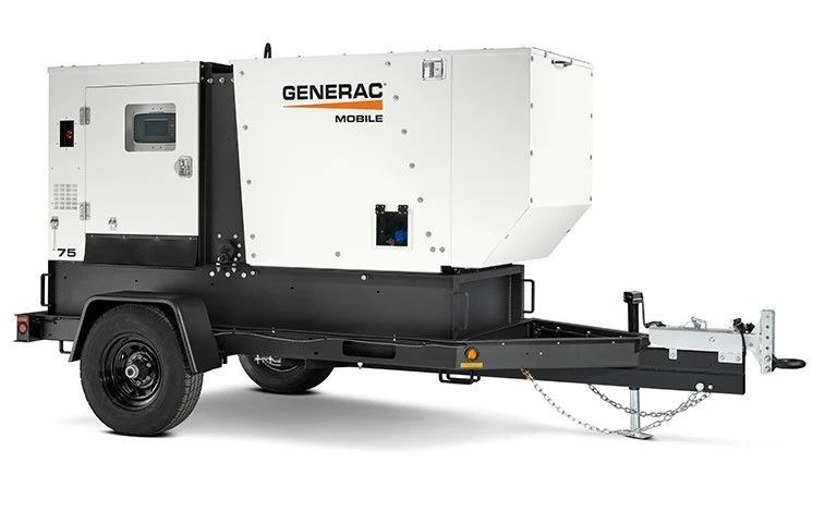 A generator is sitting on top of a trailer.