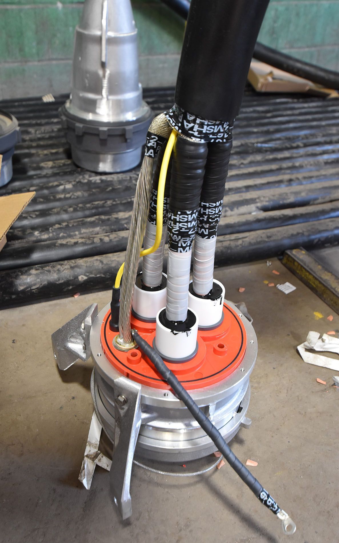 A bunch of wires are connected to a metal object