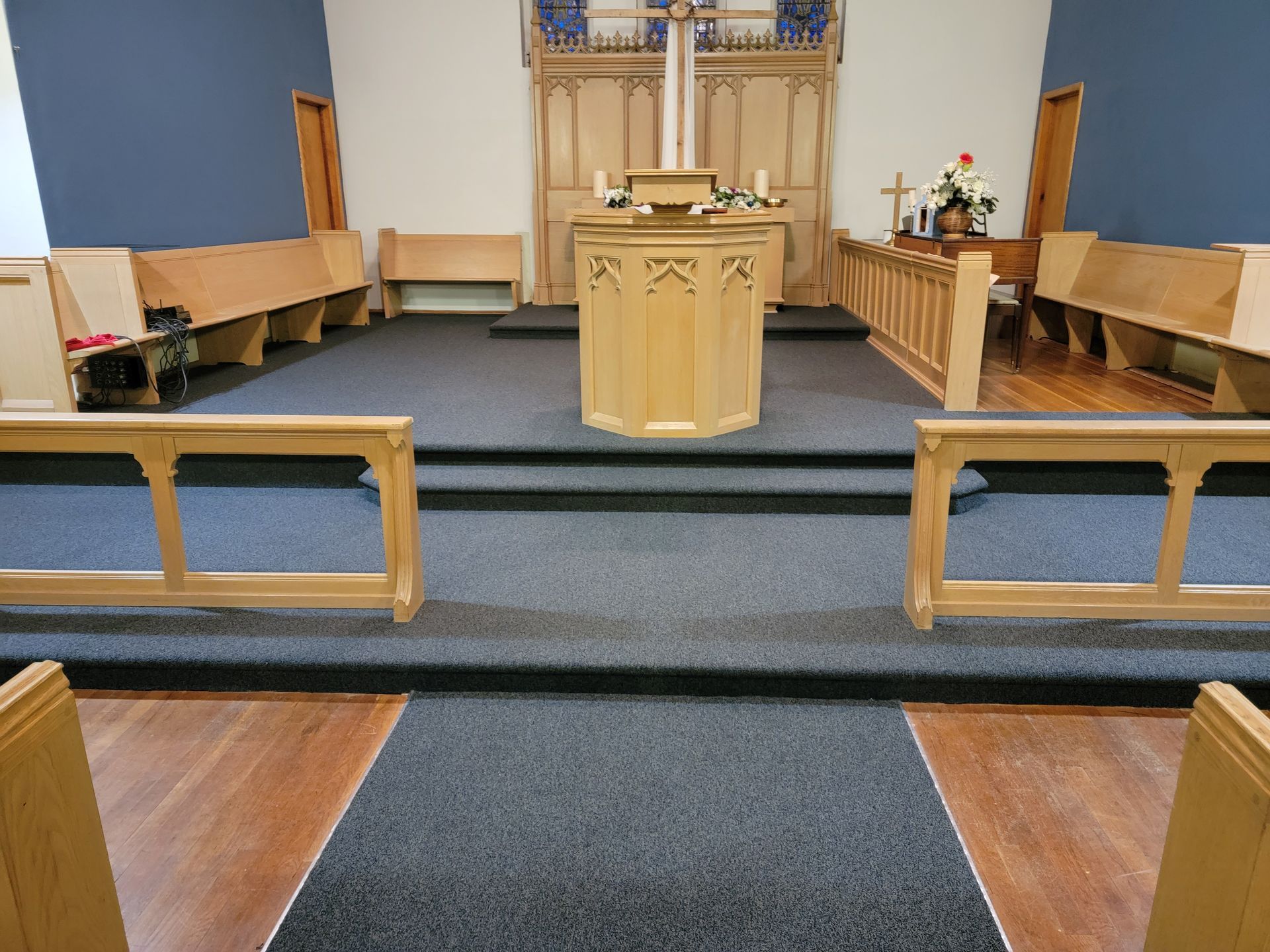 A church with a wooden altar and benches
