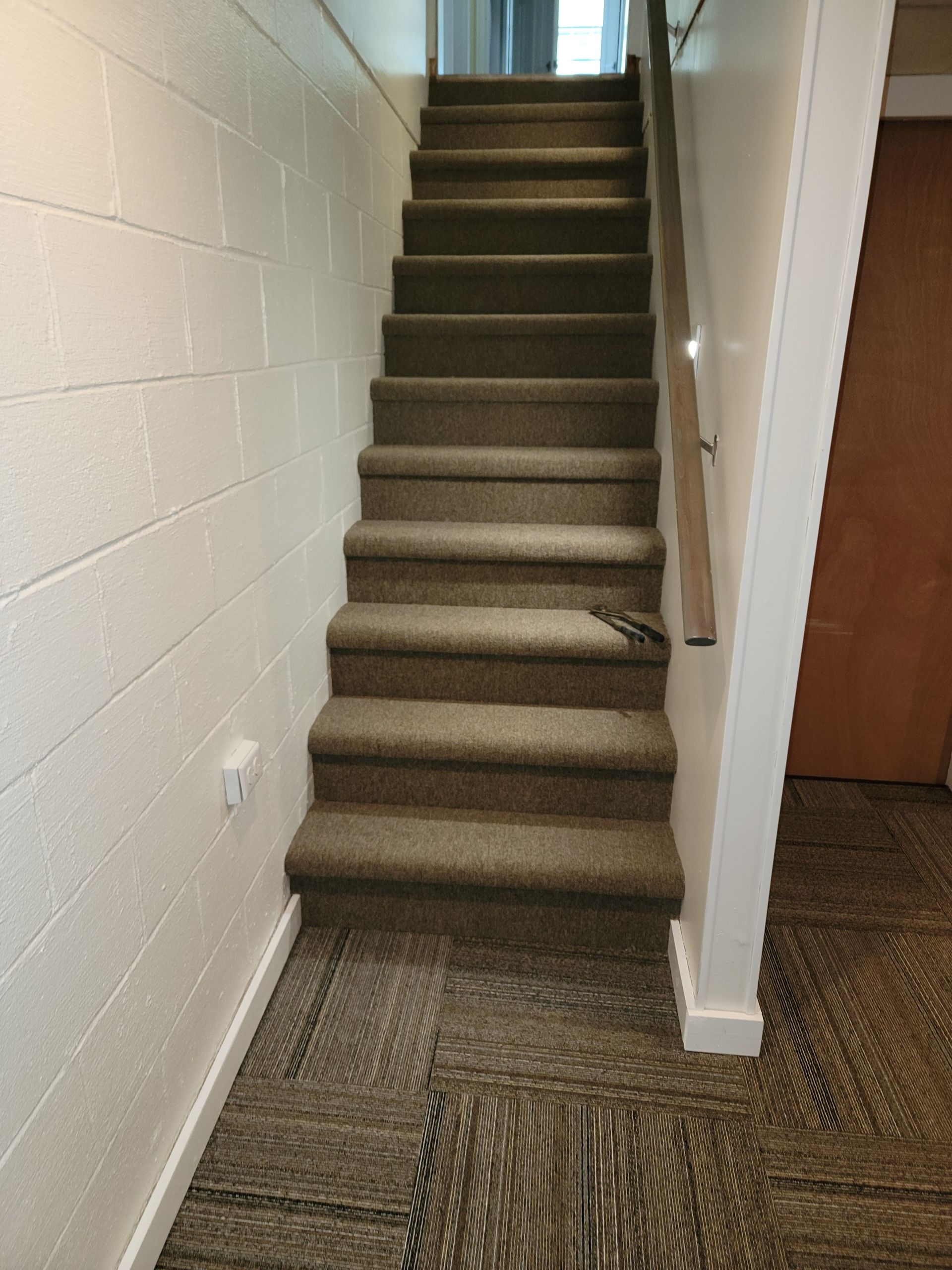 A set of stairs leading up to the second floor of a house.