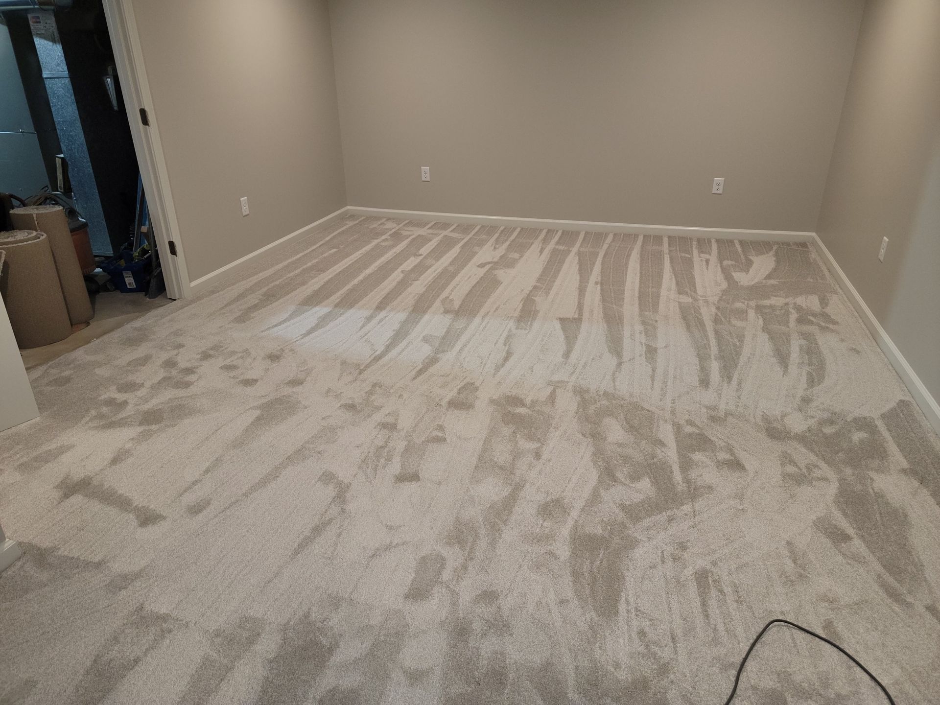 A room with a lot of carpet on the floor.