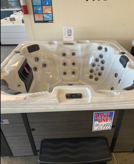 A hot tub with a sign that says last one on it