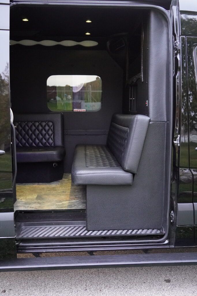 The inside of a black van with the door open
