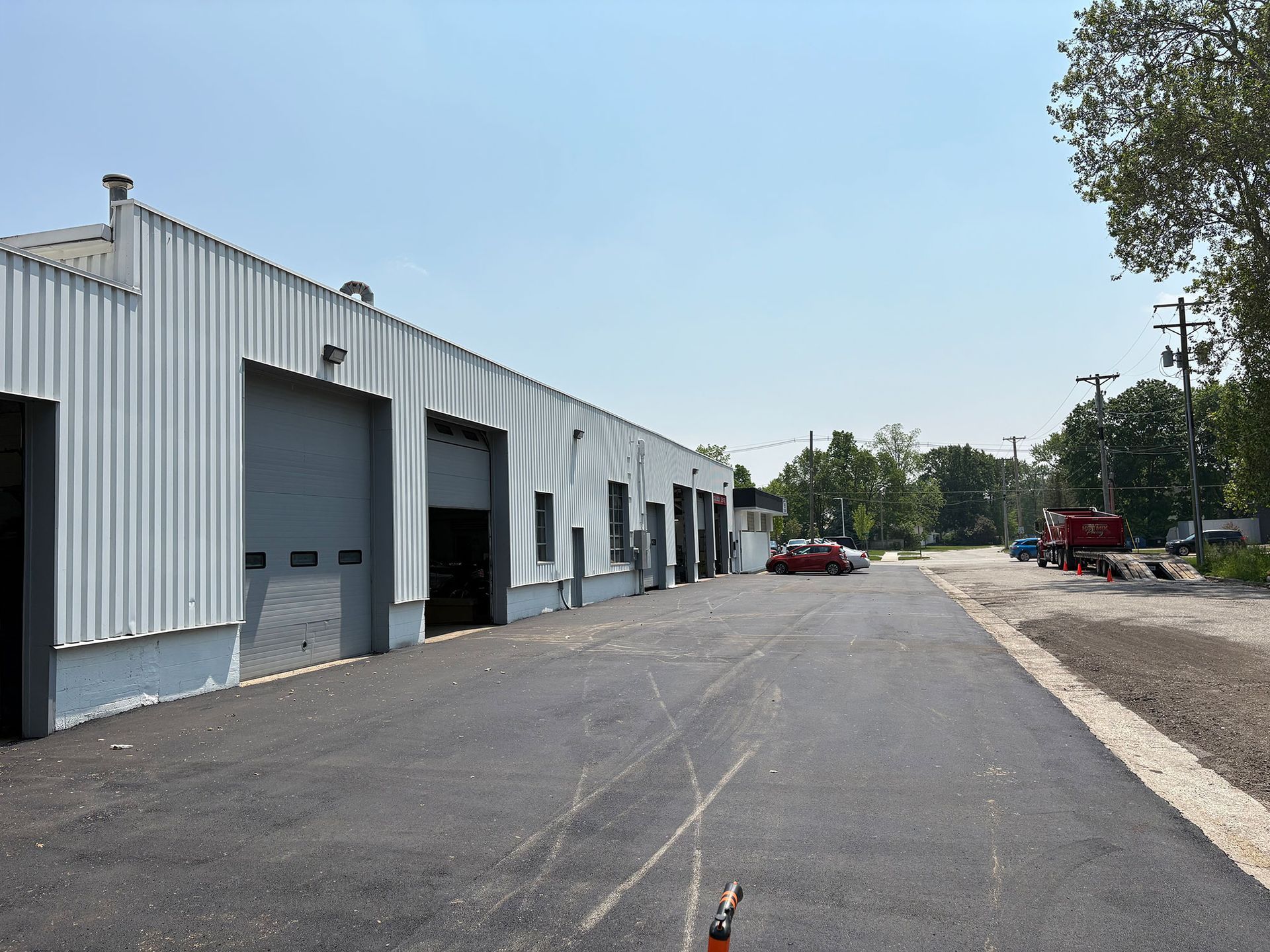 A large white building with a lot of garage doors
