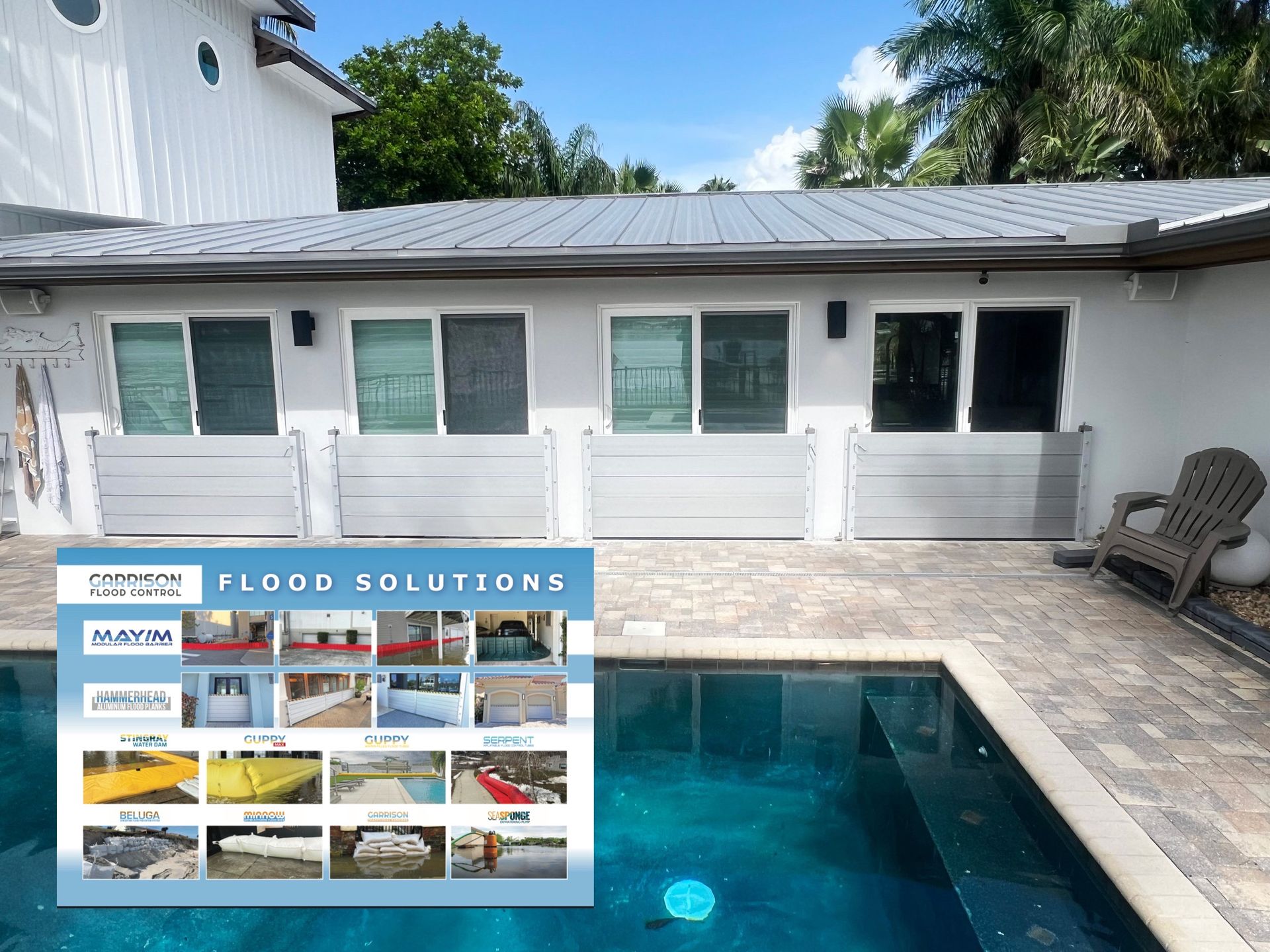 A house with flood barriers installed by a pool. A product advertisement is visible on the water's surface.