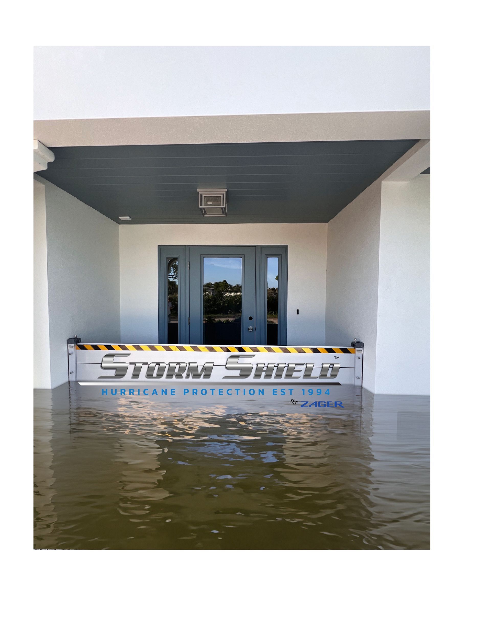 Floodwaters surround a building entrance protected by a Storm Shield barrier.
