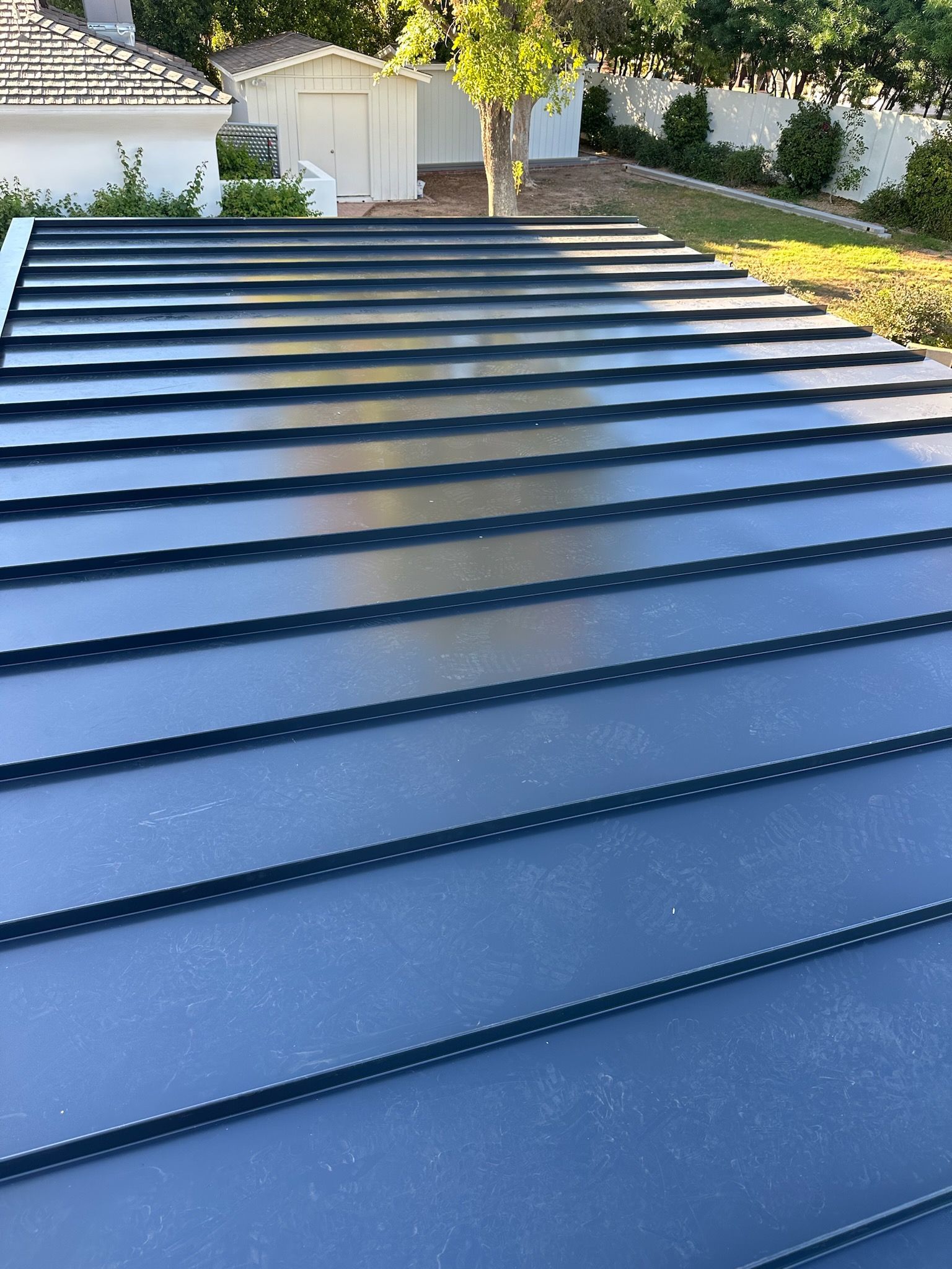 a close up of a black metal roof on a house