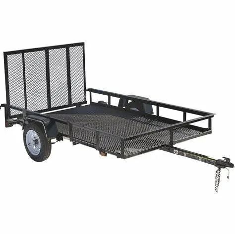 Black metal utility trailer with mesh bed and back panel, hooked to a hitch.