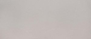 Blank light gray wall or surface with a faint shadow.