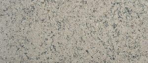 Close-up of a speckled beige and gray stone or concrete surface