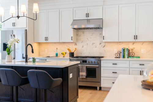 Modern kitchen with island cabinets, and white marble countertop