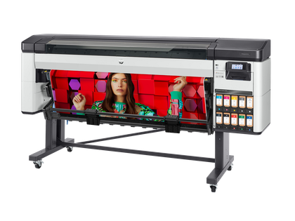 Large-format printer displaying a vibrant print with a woman on it, on a stand with ink cartridges visible.