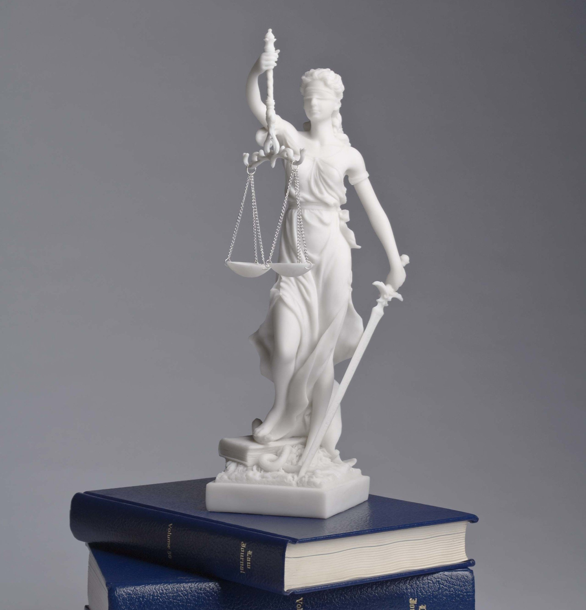 Lady justice over law books