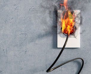 Fire and smoke on electric wire plug in indoor