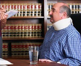 Man with neck brace in lawyer's office