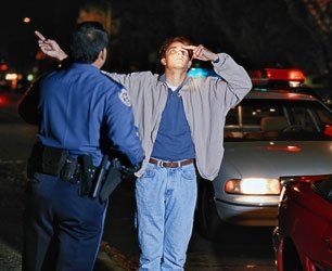 Police performs DUI test to a man
