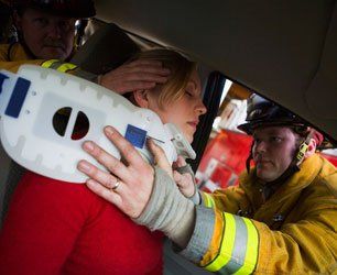 Injured woman being rescued in car accident