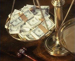 Dollar bills on the scales of justice