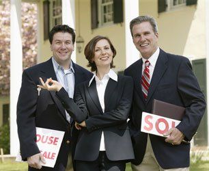 Three happy real estate agents
