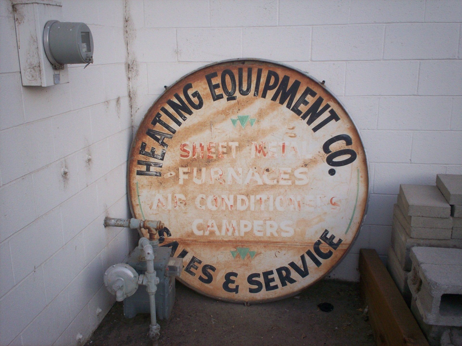 One of the original Heating Equipment Company advertisement signs