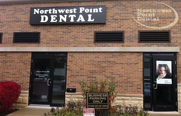 A brick building with a sign that says Northwest Point Dental