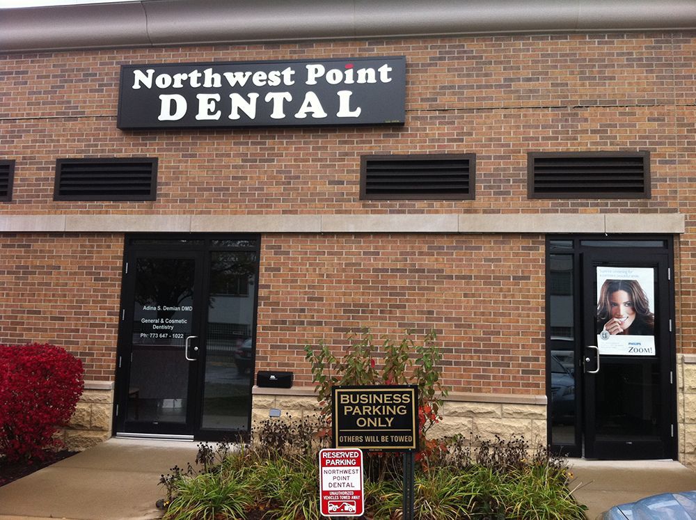 A brick building with a sign that says northwest point dental