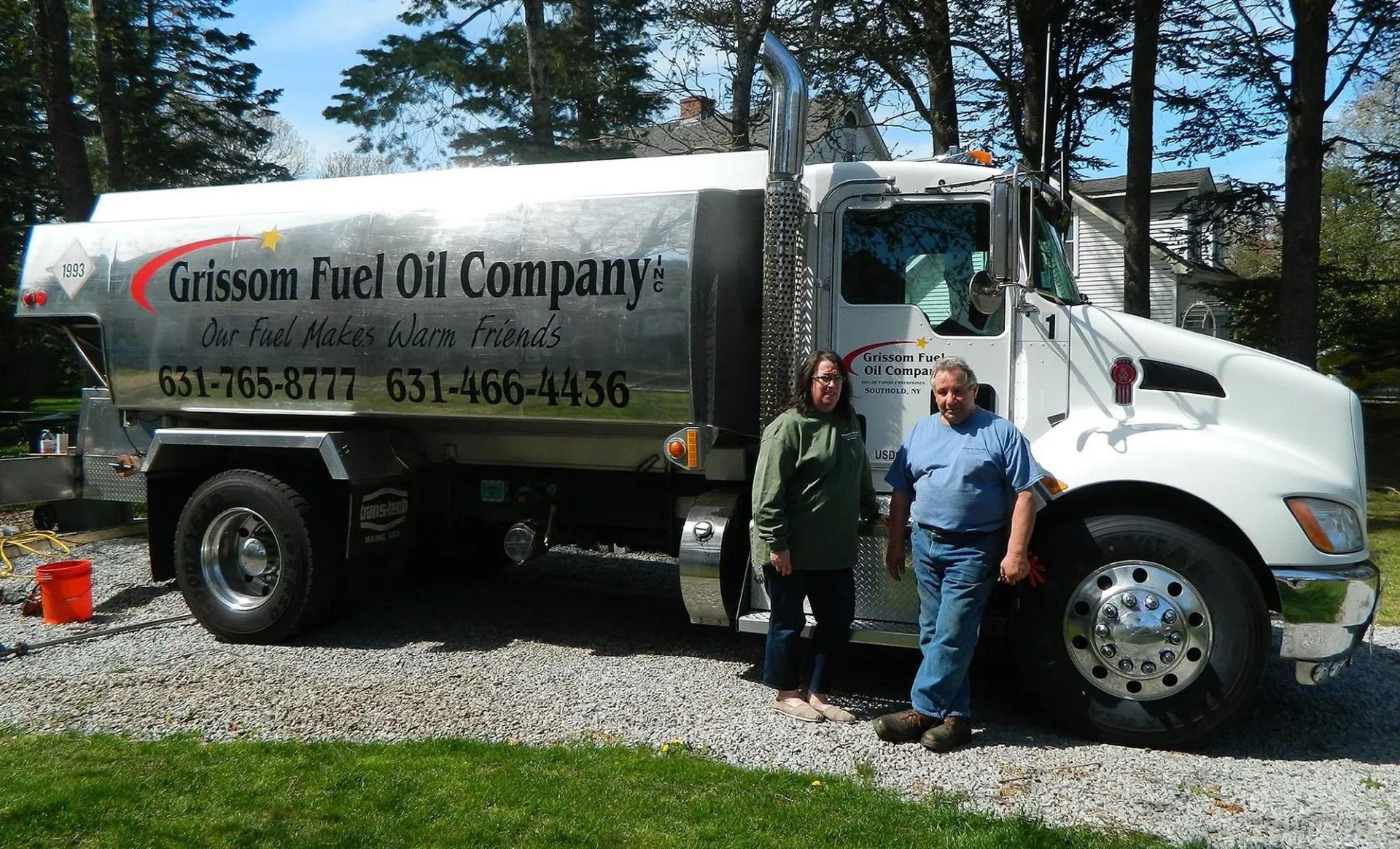 man and women with fuel truck