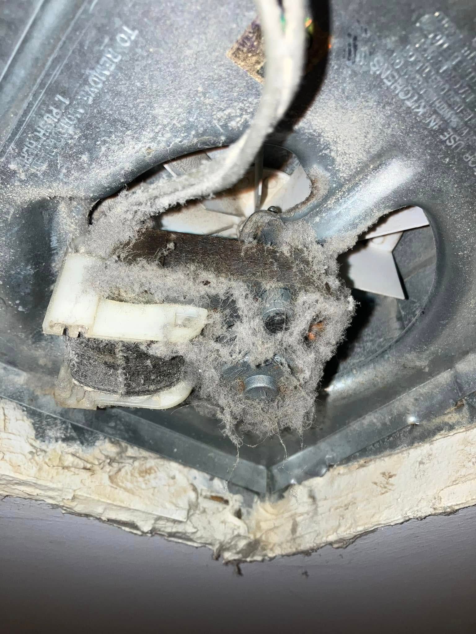 A close up of a dirty light switch on a ceiling.