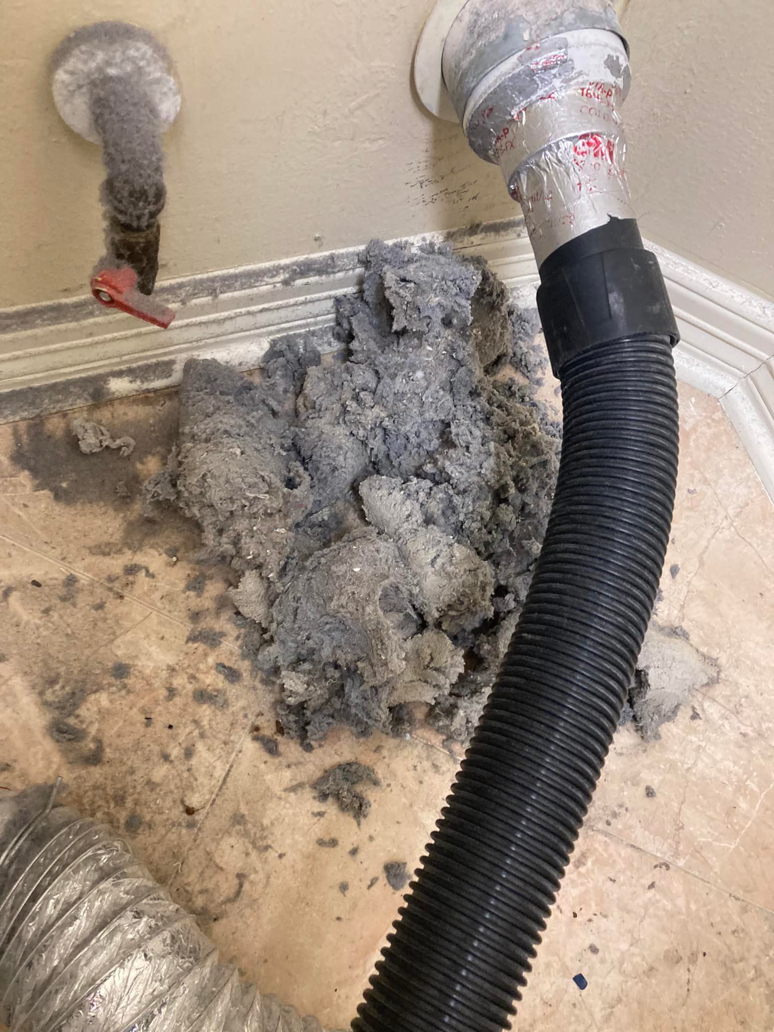 A close up of a vacuum cleaner hose filled with dust.