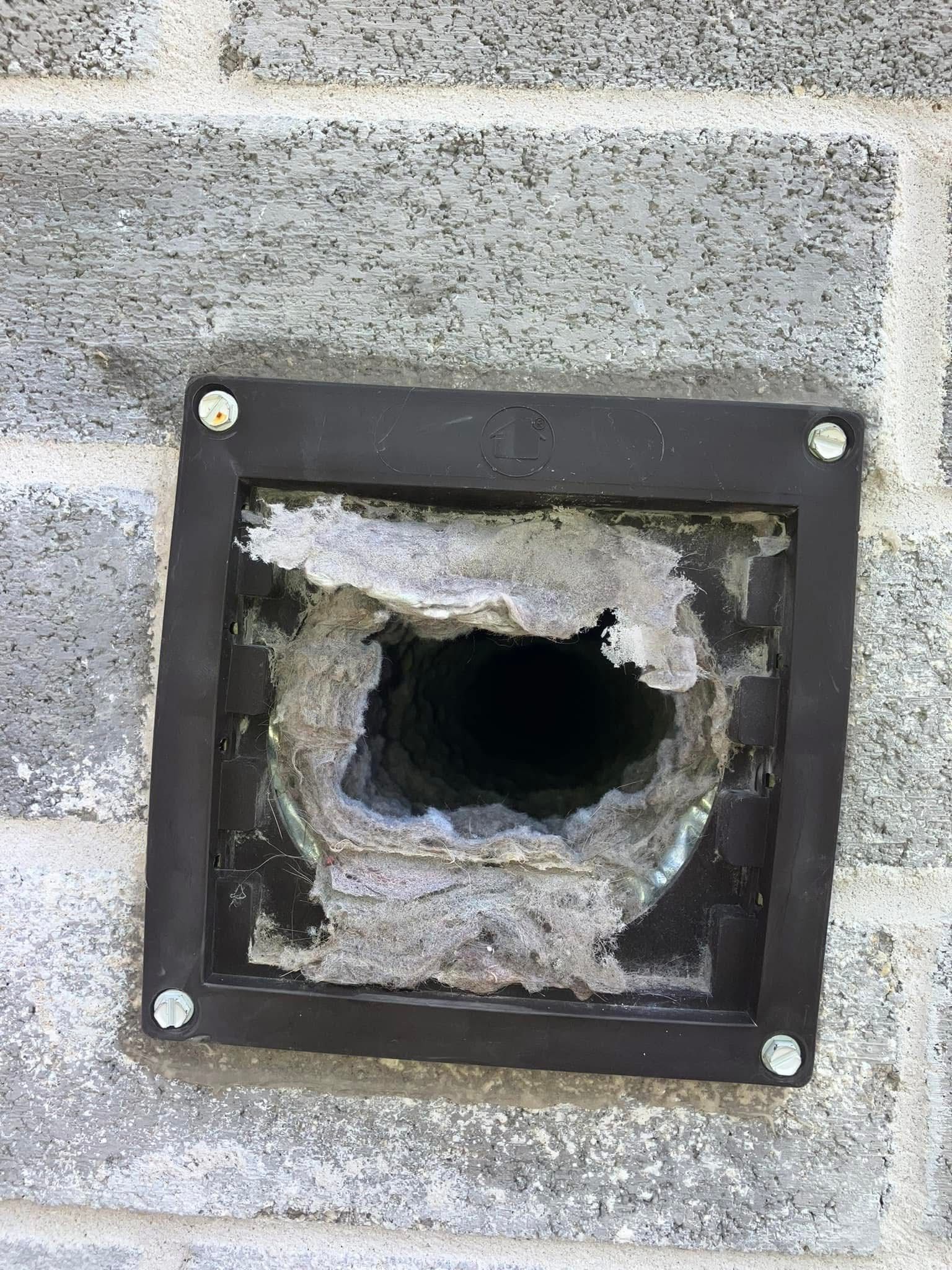 A hole in a brick wall with a hole in it.