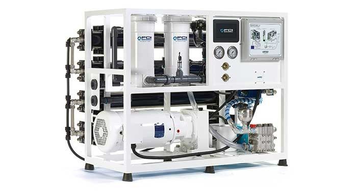 White industrial water purification machine with gauges, pipes, and control panel on a white background